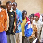 African men entering circumcision clinic